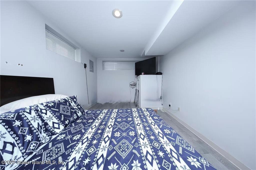 20 Buel Avenue, Unit A Staten Island, NY 10304 - Photo 19 of 30 a bedroom with bed and flat screen tv