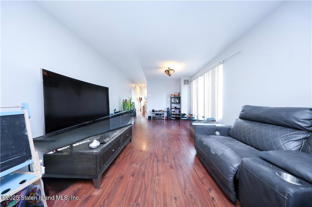 20 Buel Avenue, Unit A Staten Island, NY 10304 - Photo 4 of 30 a living room with furniture and a flat screen tv