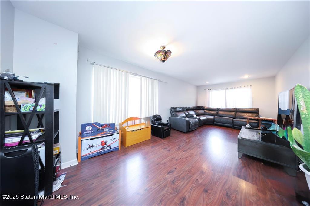 20 Buel Avenue, Unit A Staten Island, NY 10304 - Photo 7 of 30 a living room with furniture and a wooden floor