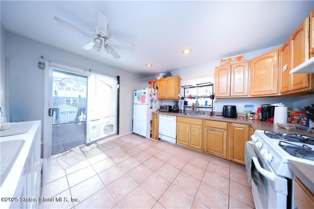 20 Buel Avenue, Unit A Staten Island, NY 10304 - Photo 8 of 30 a kitchen with stainless steel appliances granite countertop a refrigerator sink and cabinets