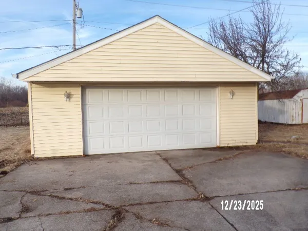 a front view of a house with a garage