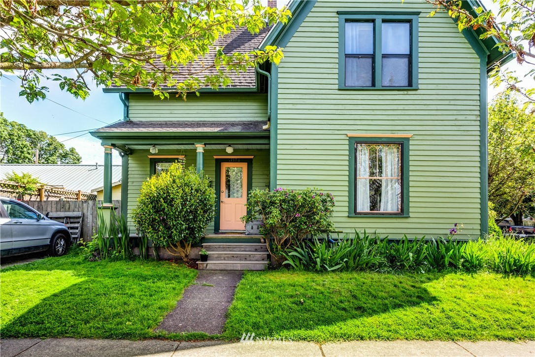 1717 Monroe Street Bellingham, WA 98225 - Photo 2 of 37 a front view of a house with a yard
