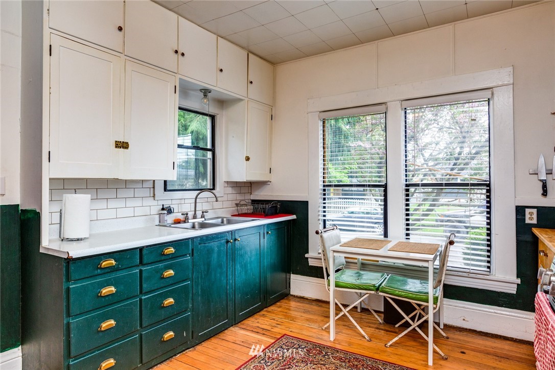 1717 Monroe Street Bellingham, WA 98225 - Photo 14 of 37 a kitchen with a cabinets appliances and a dining table