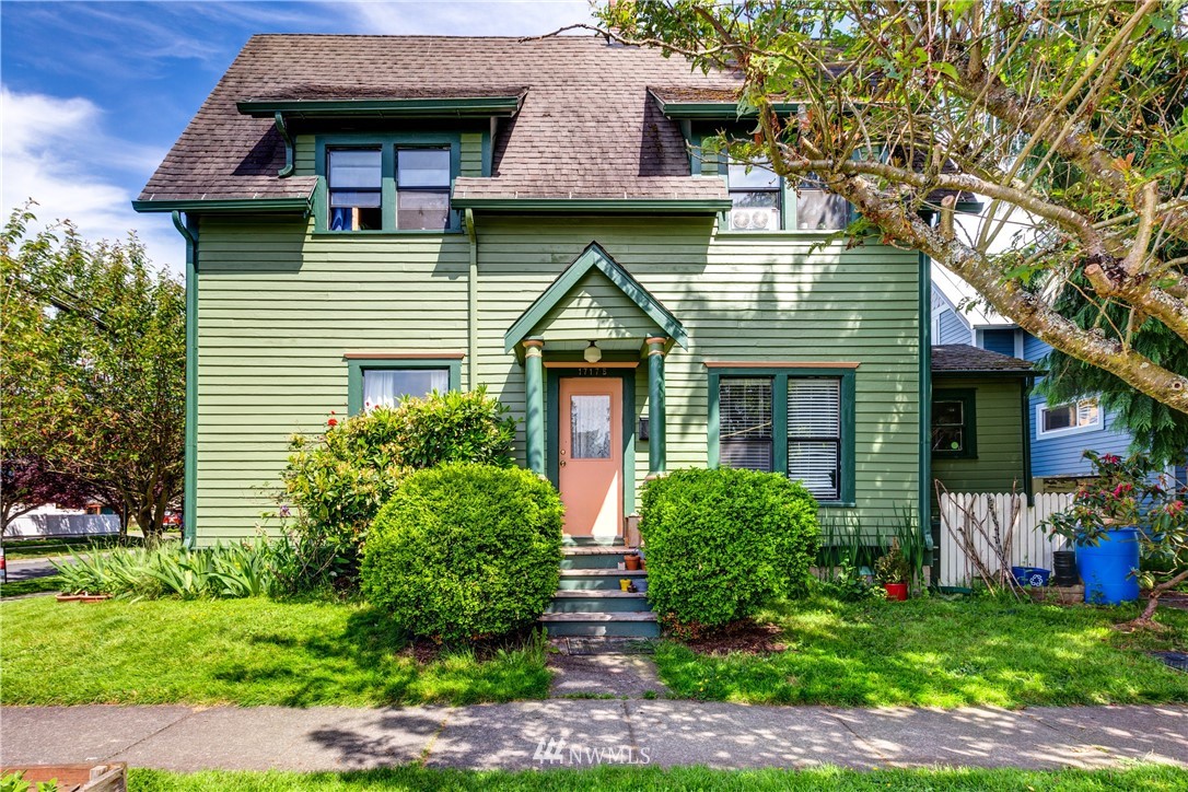 1717 Monroe Street Bellingham, WA 98225 - Photo 19 of 37 a front view of a house with garden