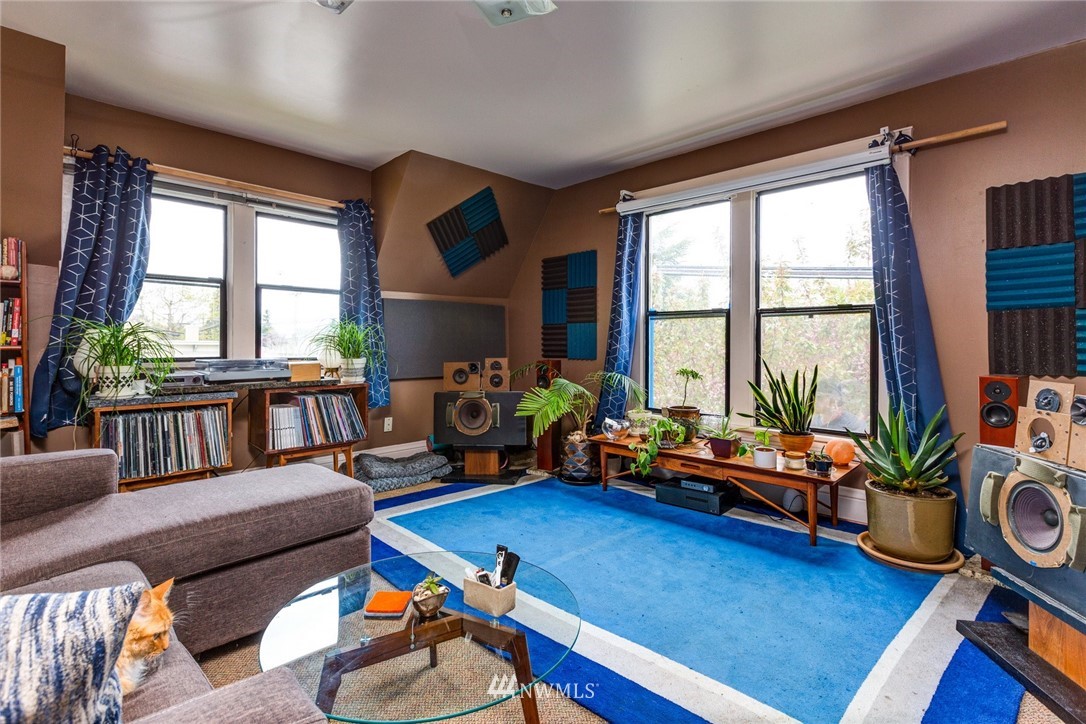 1717 Monroe Street Bellingham, WA 98225 - Photo 21 of 37 a living room with furniture and a wooden floor