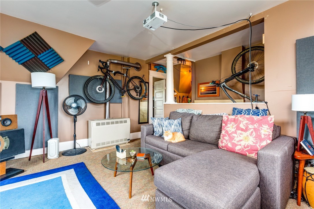 1717 Monroe Street Bellingham, WA 98225 - Photo 22 of 37 a living room with furniture and a clock