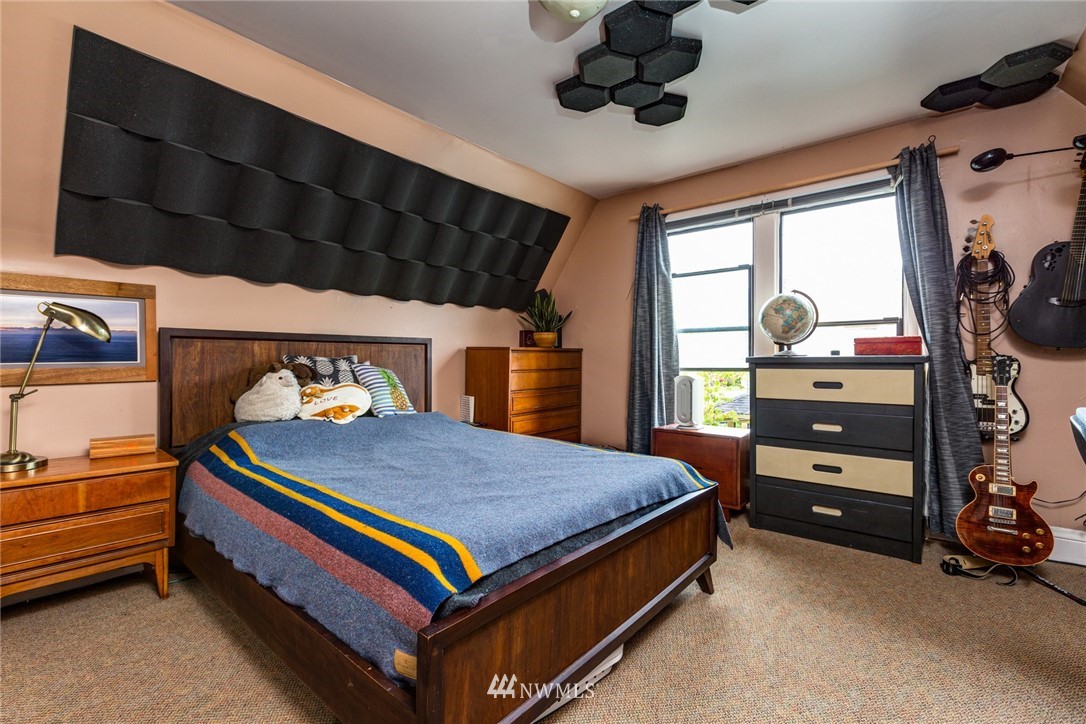 1717 Monroe Street Bellingham, WA 98225 - Photo 25 of 37 a bed room with a bed and a tv