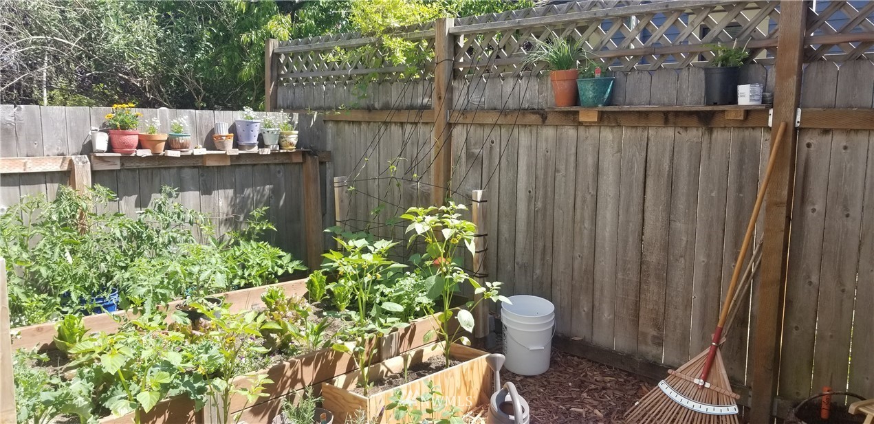1717 Monroe Street Bellingham, WA 98225 - Photo 33 of 37 a wooden fence with some potted plants