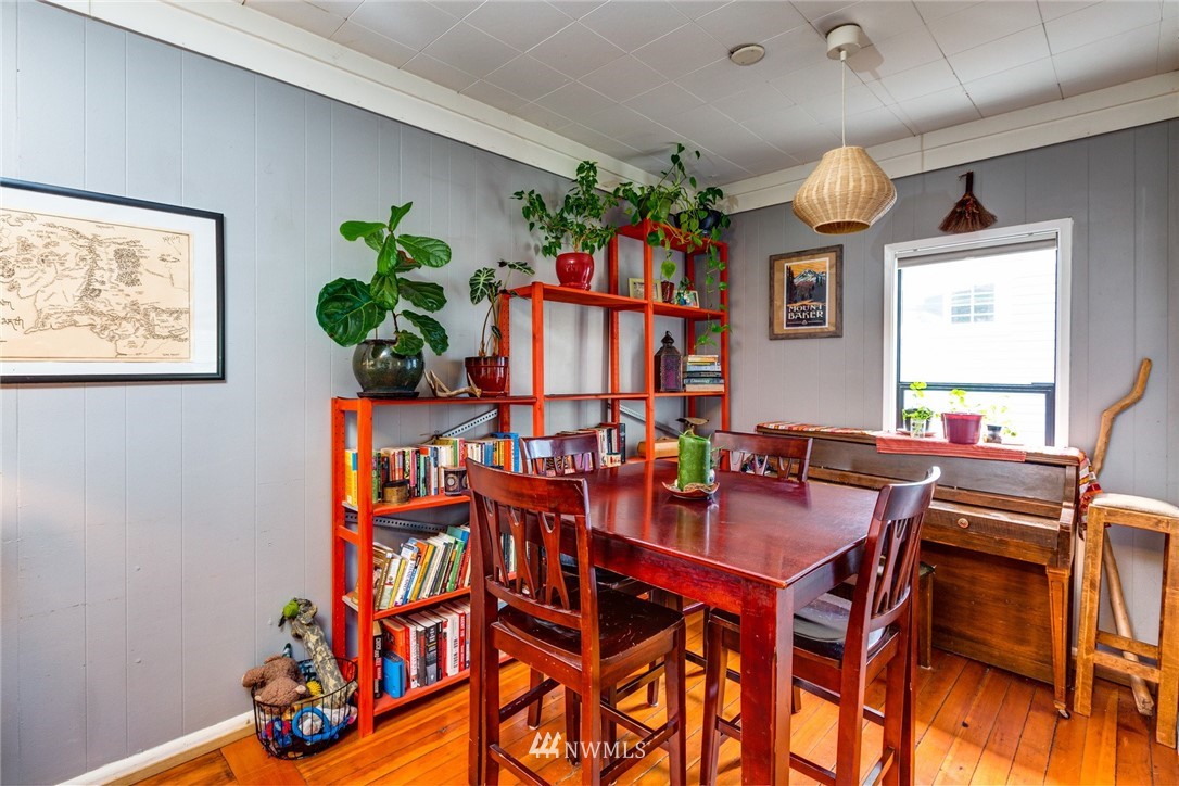 1717 Monroe Street Bellingham, WA 98225 - Photo 7 of 37 a view of a dining room with furniture and a potted plant