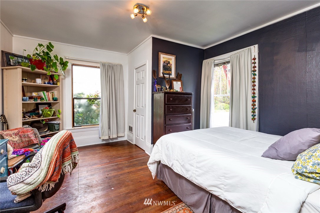 1717 Monroe Street Bellingham, WA 98225 - Photo 9 of 37 a spacious bedroom with a bed and a window