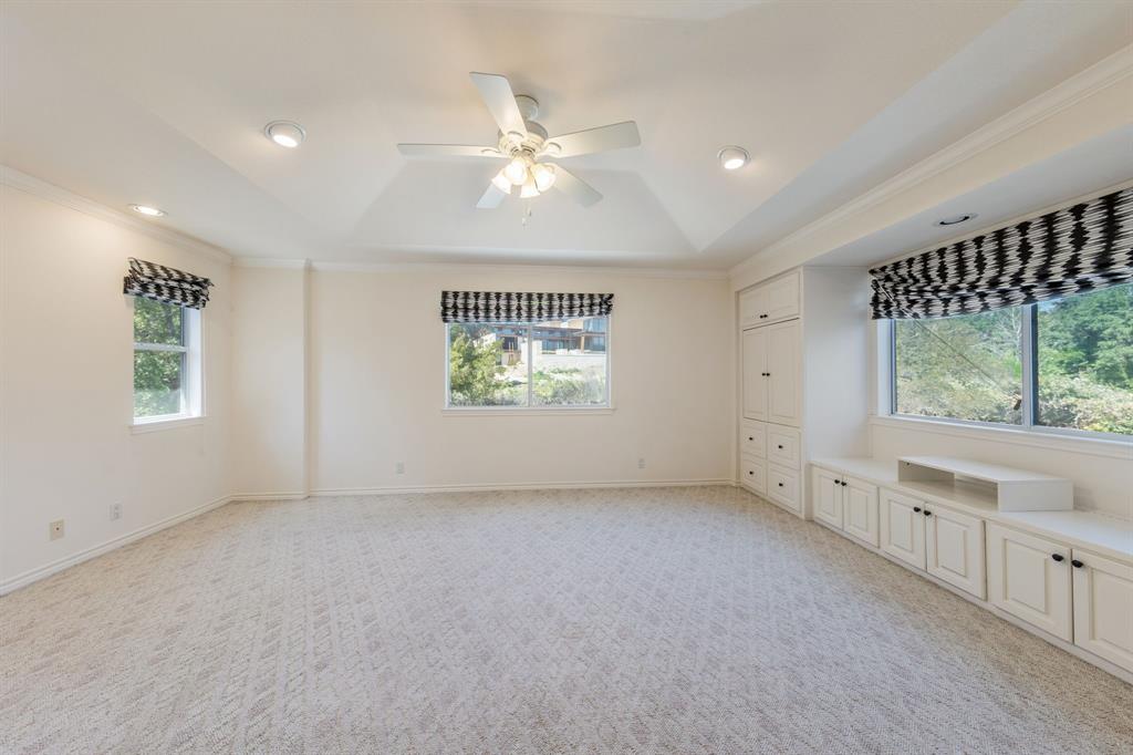 1704 Randolph Ridge Trail Austin, TX 78746 - Photo 16 of 23 Primary bedroom with built ins