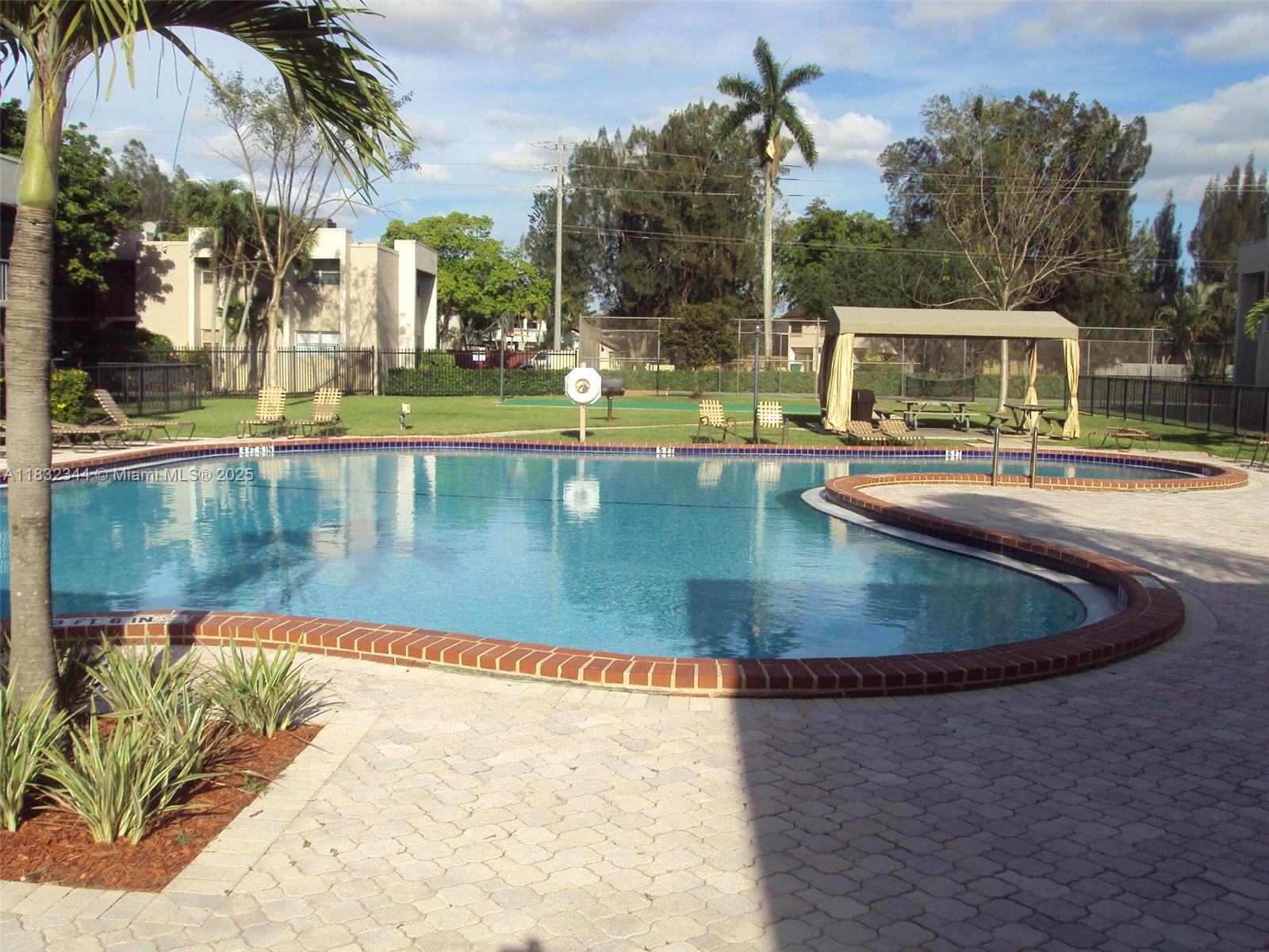 Davie Davie, FL 33328 - Photo 2 of 4 a view of a swimming pool with a yard