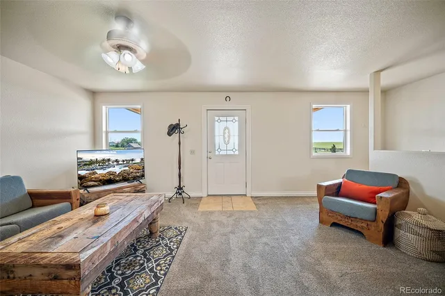 a bedroom with furniture and a chandelier
