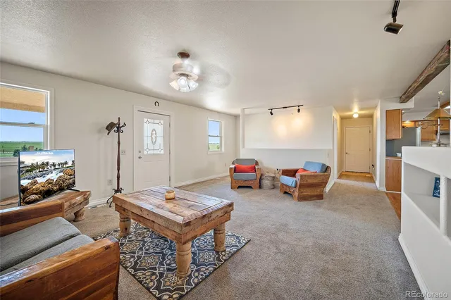 a living room with furniture and a table