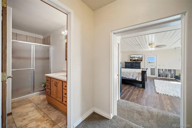 a en suite bathroom with a sink and a mirror