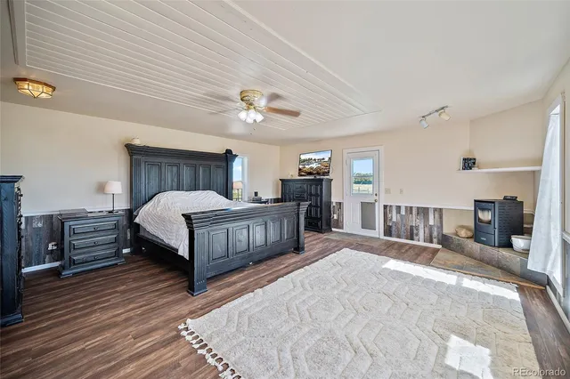 a bedroom with bed and a chandelier