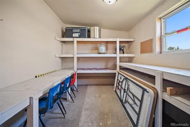 a view of an empty room with shelves