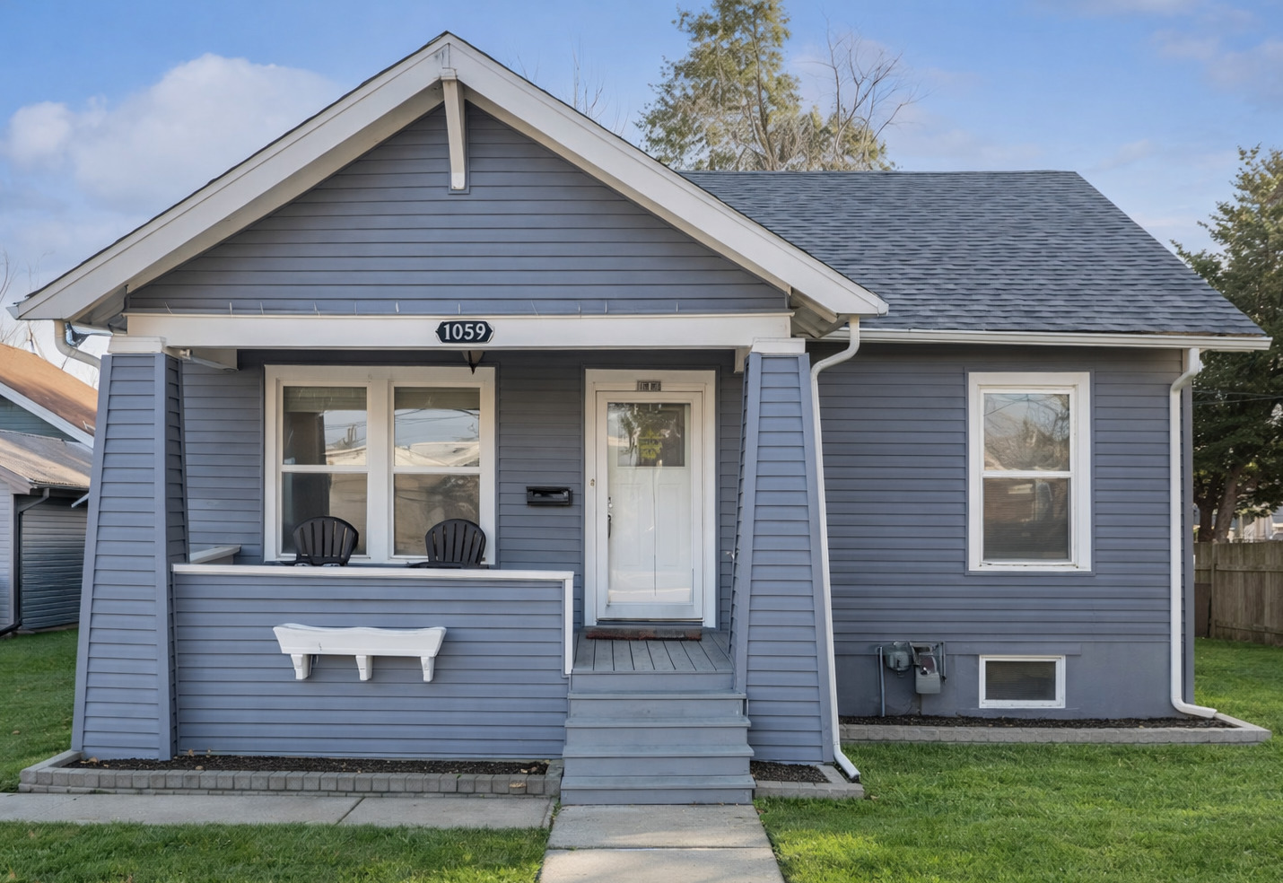 1059 Larkin Avenue Elgin, IL 60123 - Photo 1 of 25 a front view of a house with garden