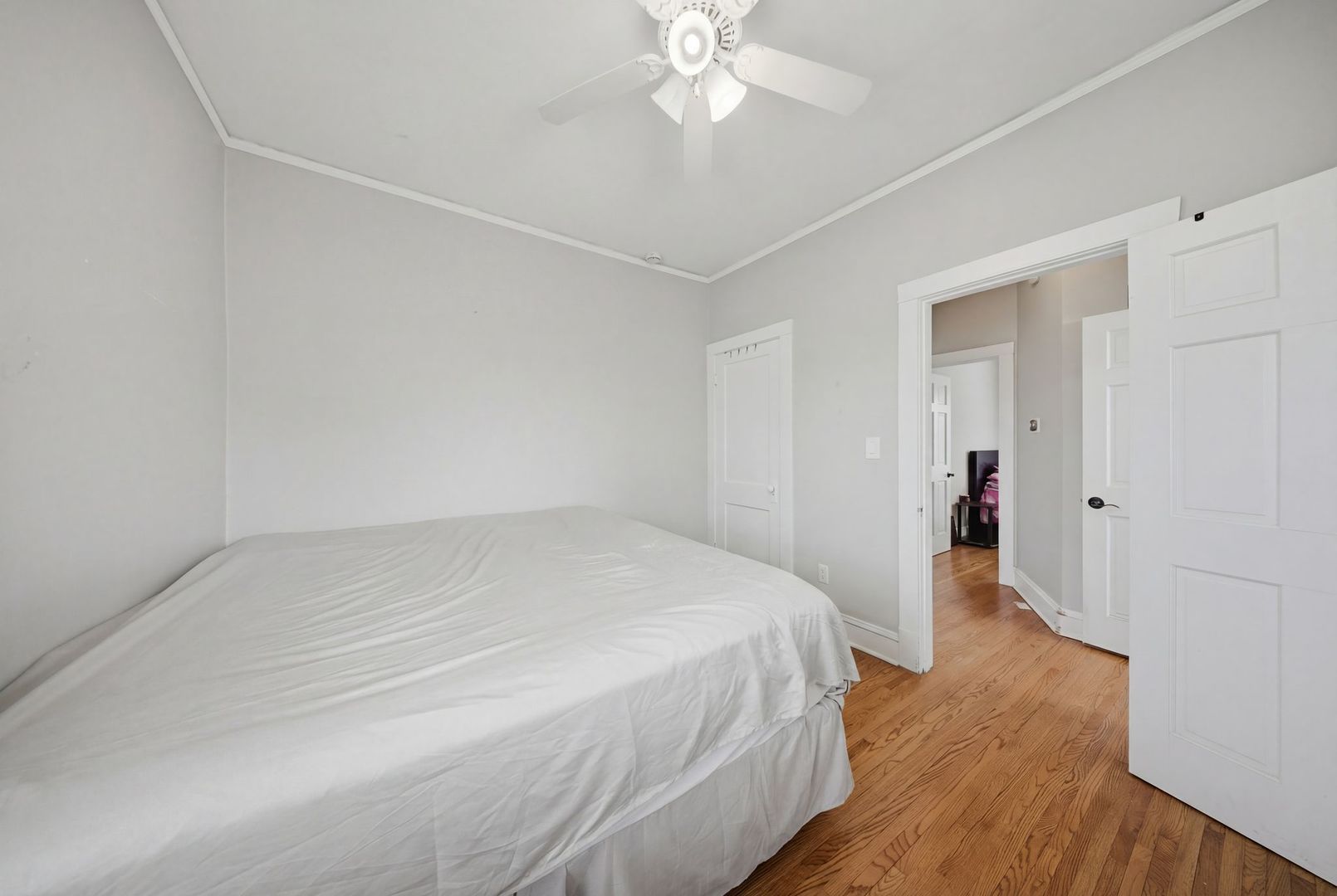 1059 Larkin Avenue Elgin, IL 60123 - Photo 12 of 25 a bedroom with a bed and a chandelier