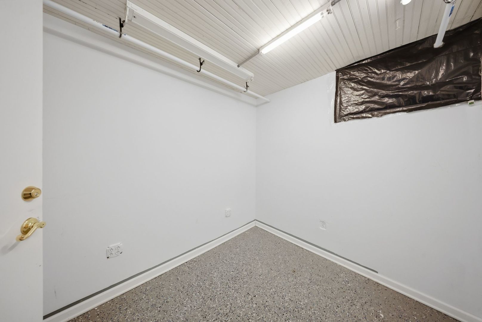 1059 Larkin Avenue Elgin, IL 60123 - Photo 19 of 25 a view of a wall with rack on the wall
