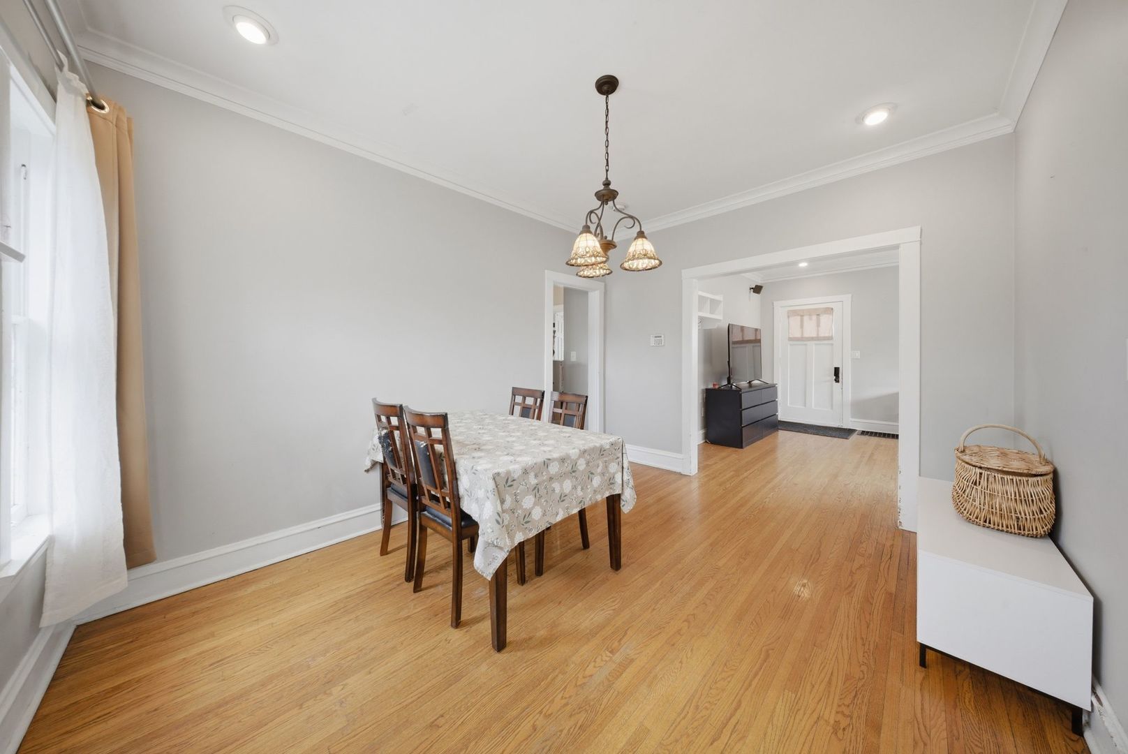 1059 Larkin Avenue Elgin, IL 60123 - Photo 5 of 25 a living room with furniture and a chandelier