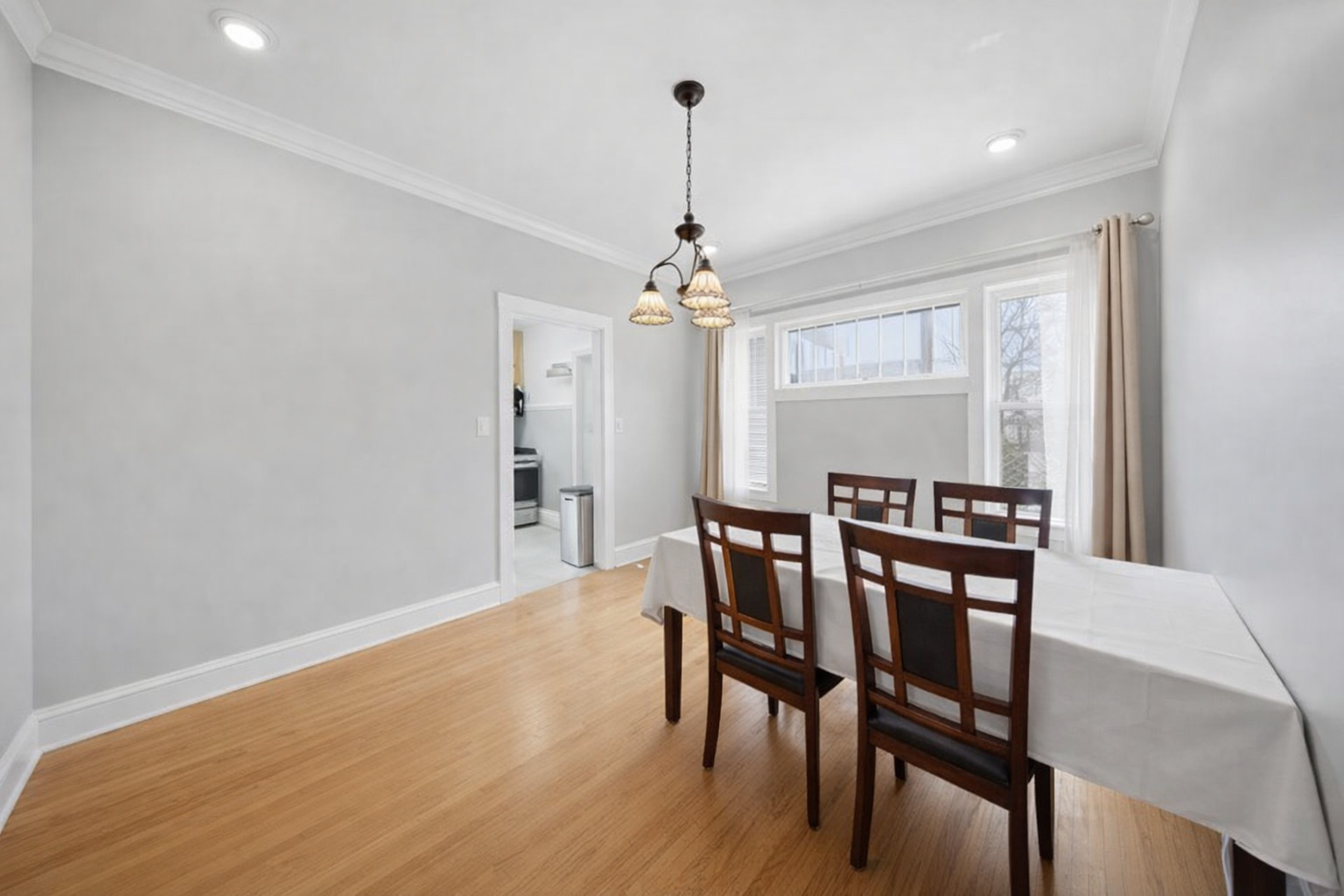 1059 Larkin Avenue Elgin, IL 60123 - Photo 6 of 25 a view of a dining room with furniture window and wooden floor