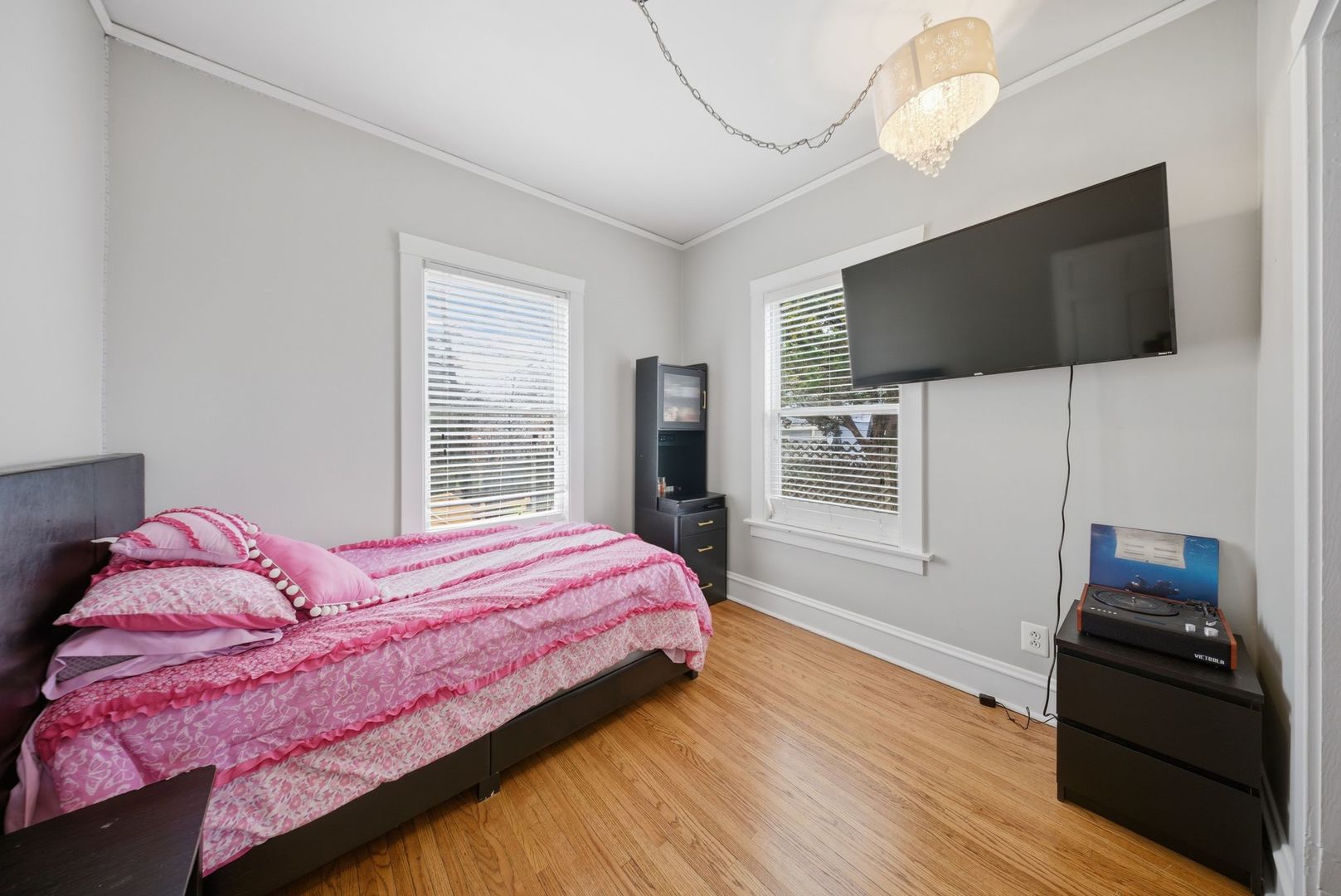 1059 Larkin Avenue Elgin, IL 60123 - Photo 9 of 25 a bedroom with a bed and a flat screen tv