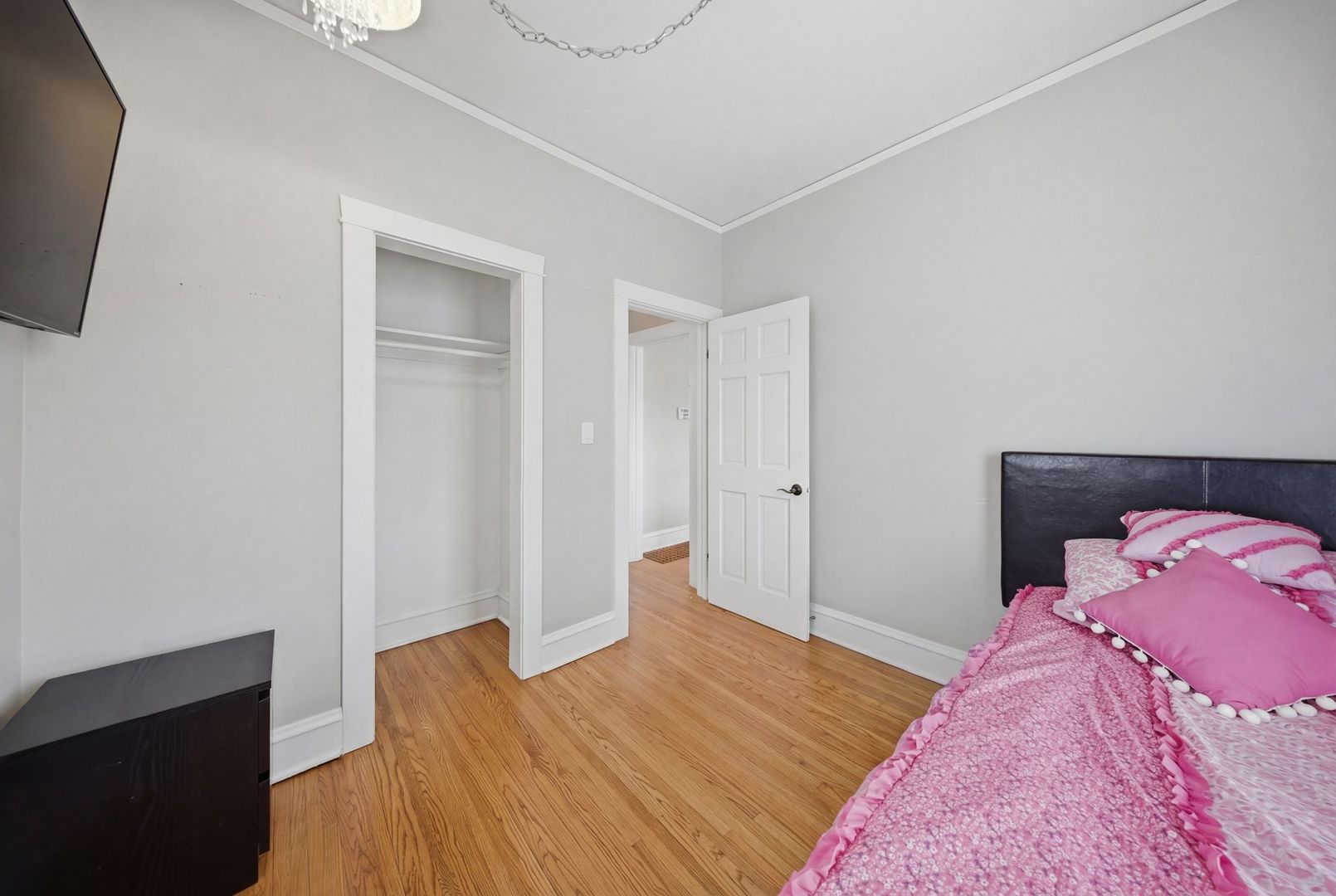 1059 Larkin Avenue Elgin, IL 60123 - Photo 10 of 25 a bedroom with a bed and a flat screen tv