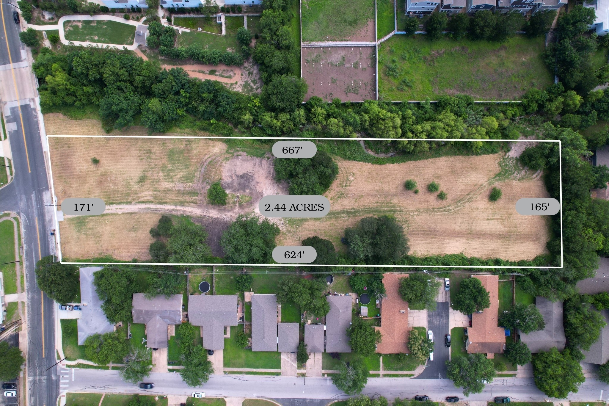 2610-2606 Metcalfe Road Austin, TX 78741 - Photo 2 of 20 Discover a generous 2.44-acre lot, presenting a prime development opportunity amidst a developed neighborhood.