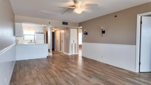 an aerial view of a house with garden space and street view