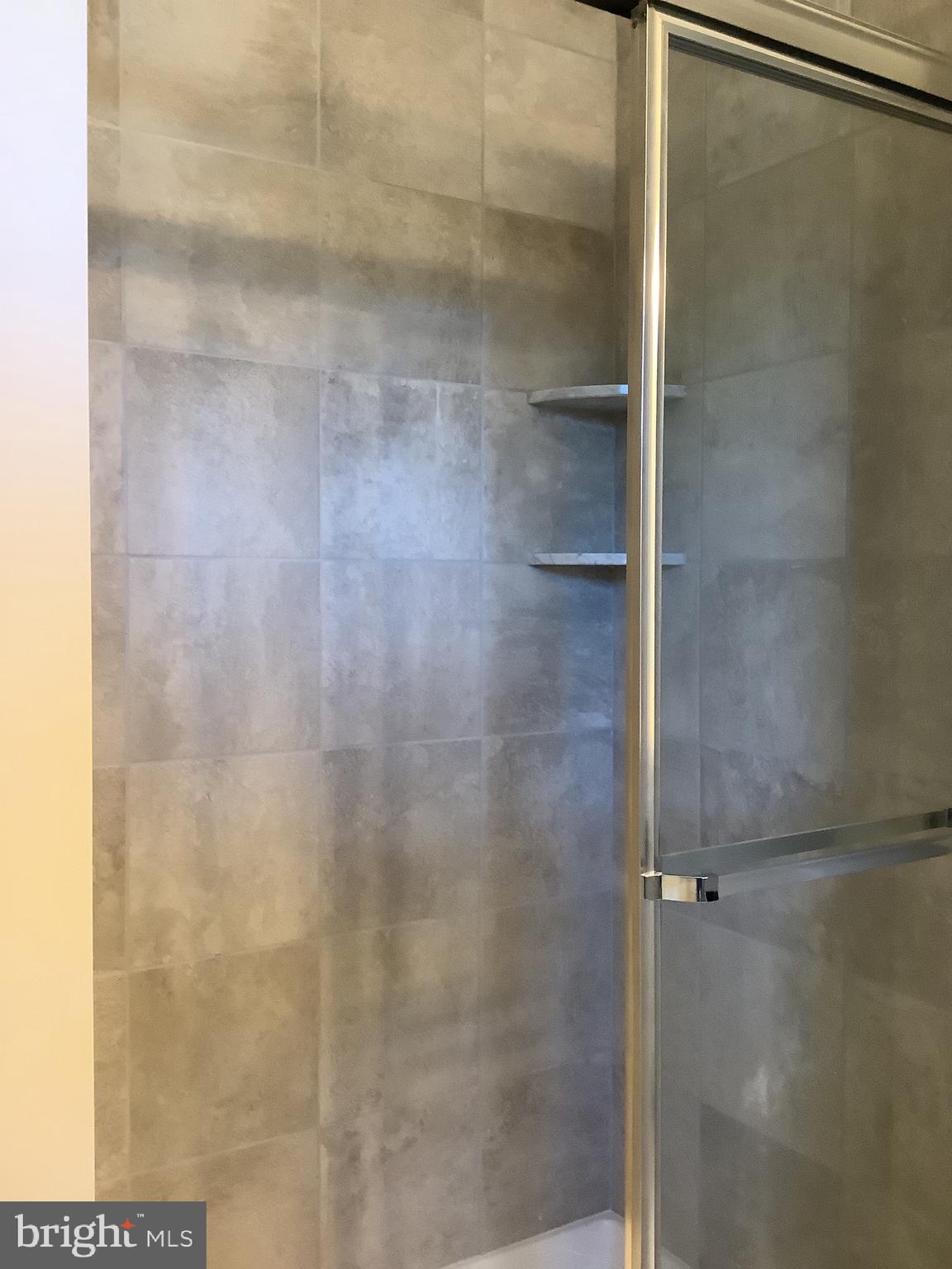 7862 Outing Avenue Pasadena, MD 21122 - Photo 10 of 19 Step in shower in Primary Bath