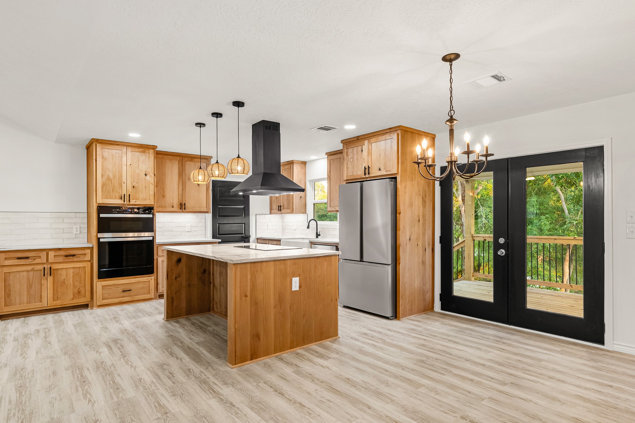 90 Cool Crest Point Blank, TX 77364 - Photo 12 of 40 a kitchen with stainless steel appliances granite countertop a refrigerator a sink dishwasher a oven and a dining table with wooden floor