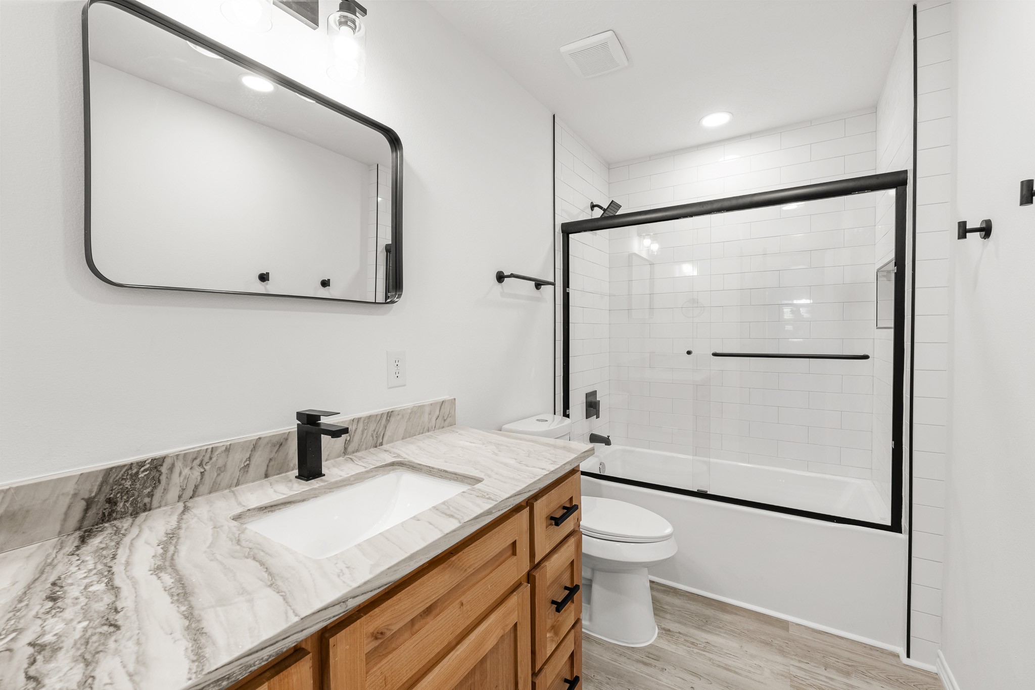90 Cool Crest Point Blank, TX 77364 - Photo 19 of 40 a bathroom with a granite countertop sink toilet a mirror and shower