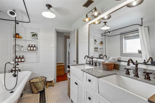 a close view of a sink a stove and a table in a kitchen