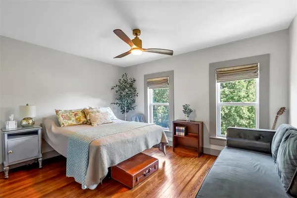 a bedroom with furniture and a window