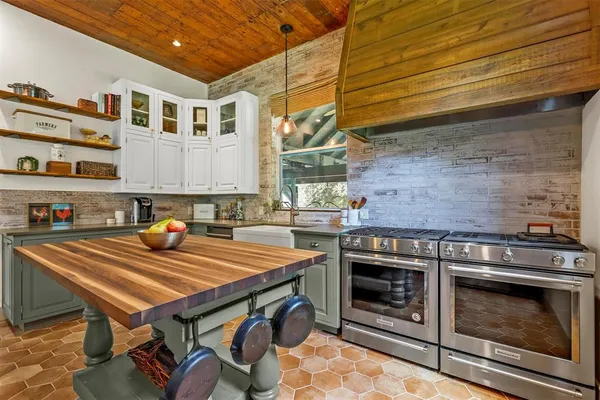 a kitchen with a stove and a microwave