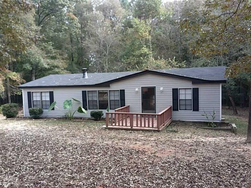 7419 Williams Road Flowery Branch, GA 30542 - Photo 1 of 1 a view of a house with a yard