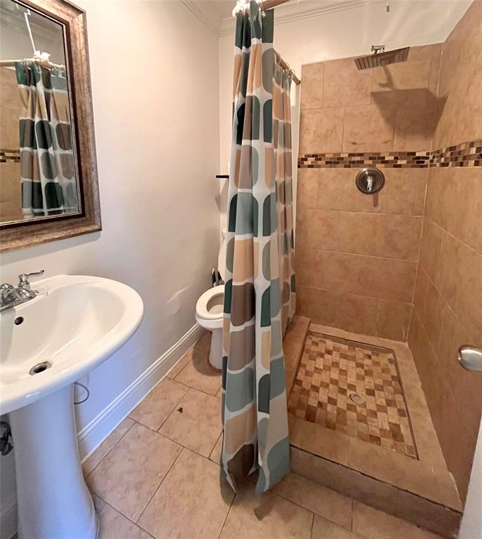 1324 Maple Drive Garland, TX 75040 - Photo 10 of 10 a bathroom with a sink toilet and shower