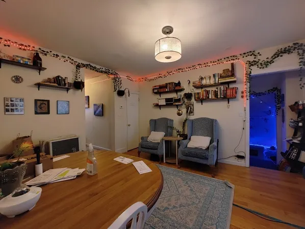a bedroom with furniture and a chandelier