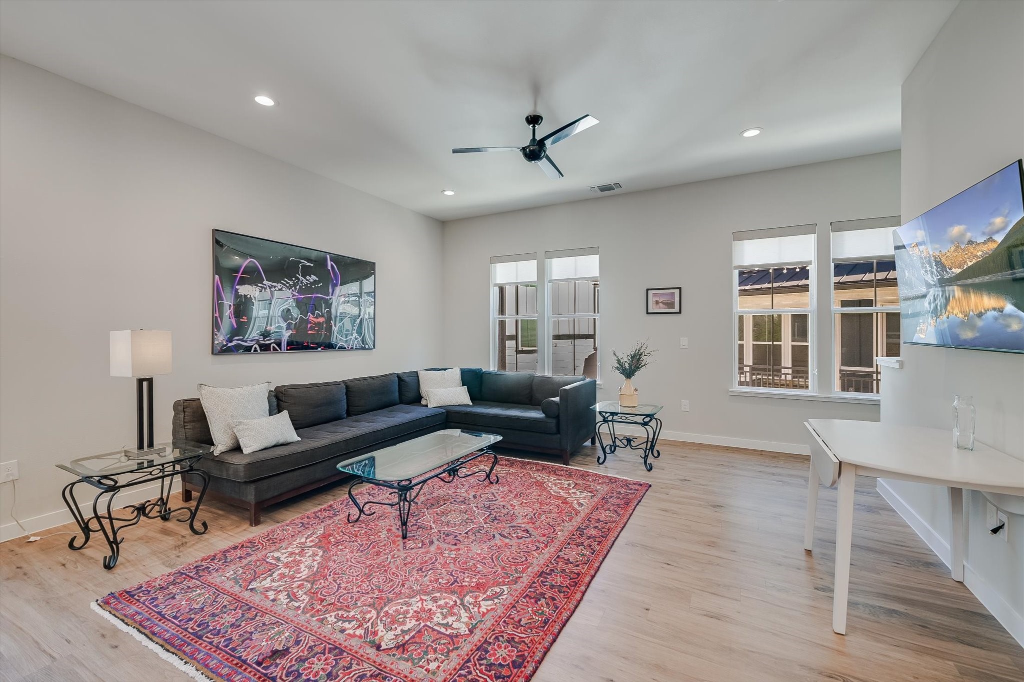 3809 Valley View Road, Unit 7 Austin, TX 78704 - Photo 4 of 21 Living room with light hardwood / wood-style flooring and ceiling fan