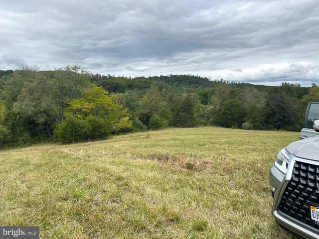 a view of an ocean and mountain