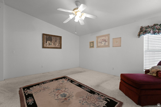2600 North Hill Field Road, Unit 134 Layton, UT 84041 - Photo 19 of 41 Sitting room featuring ceiling fan, carpet, and lofted ceiling