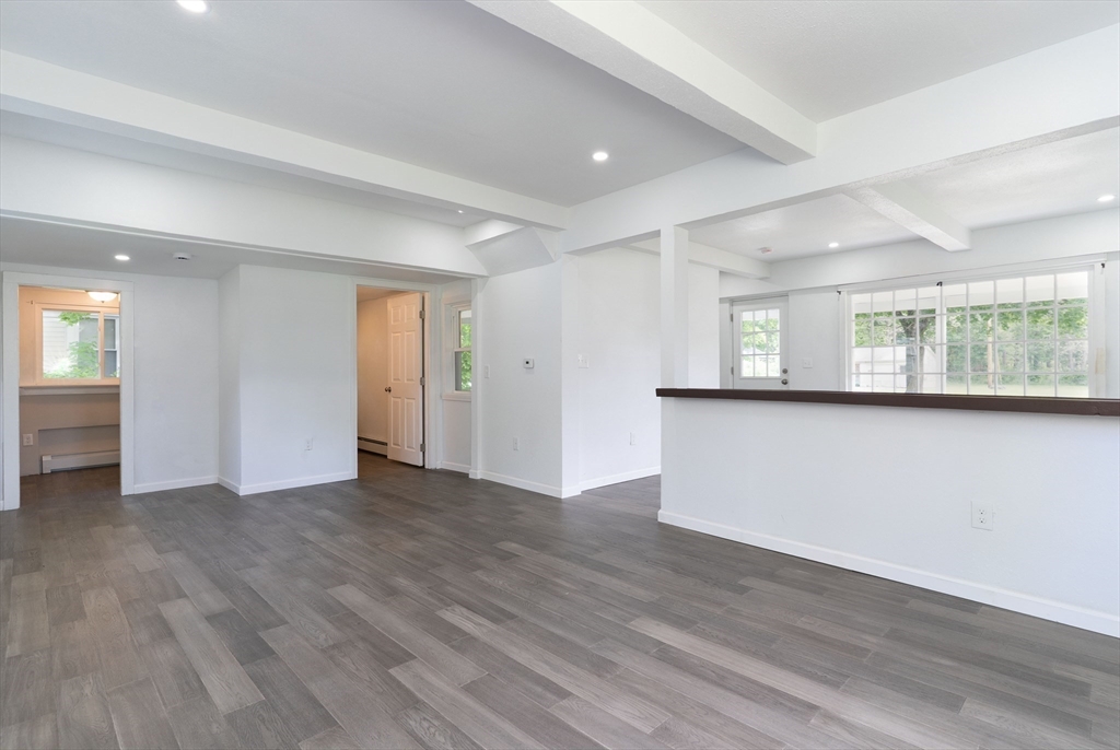 1240 South Main Street Palmer, MA 01069 - Photo 12 of 31 a view of an empty room with wooden floor and a window