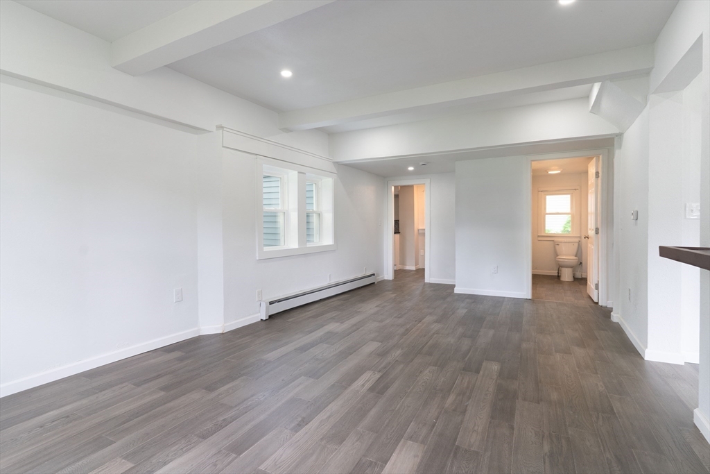 1240 South Main Street Palmer, MA 01069 - Photo 13 of 31 wooden floor in an empty room with a window