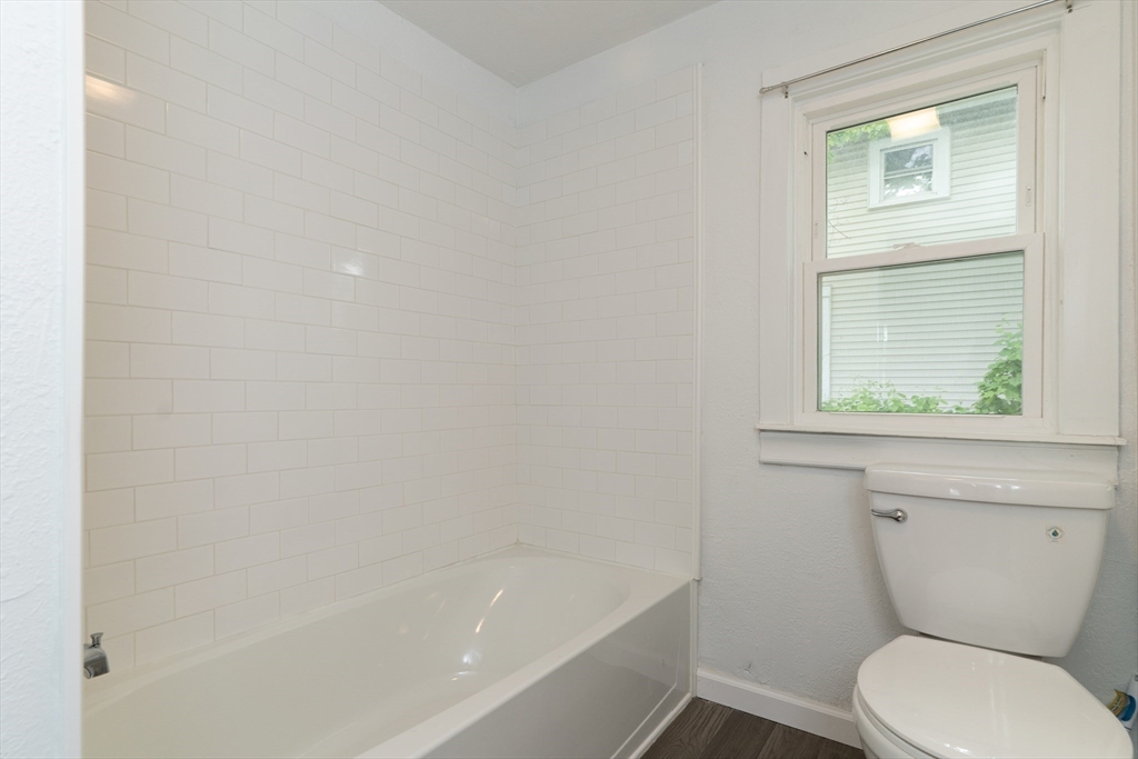 1240 South Main Street Palmer, MA 01069 - Photo 15 of 31 a bathroom with a toilet and a bathtub