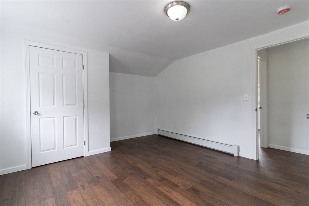 1240 South Main Street Palmer, MA 01069 - Photo 23 of 31 a view of an empty room with wooden floor