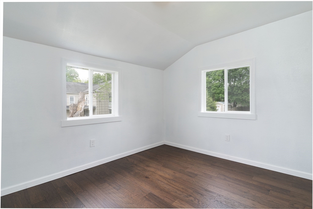 1240 South Main Street Palmer, MA 01069 - Photo 25 of 31 an empty room with wooden floor and windows