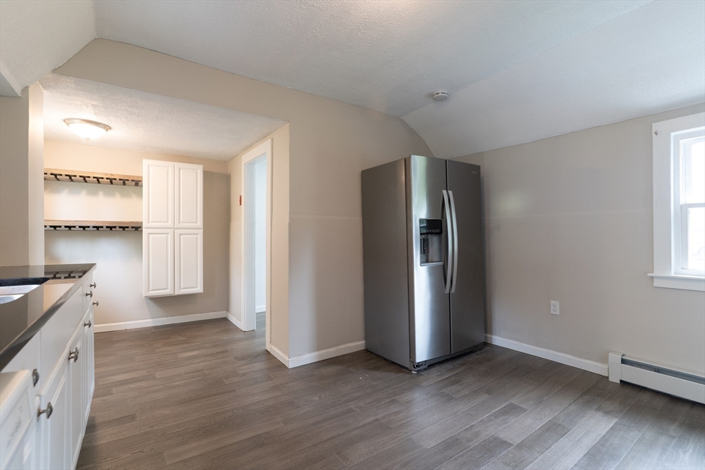1240 South Main Street Palmer, MA 01069 - Photo 6 of 31 wooden floor in an empty room with a window