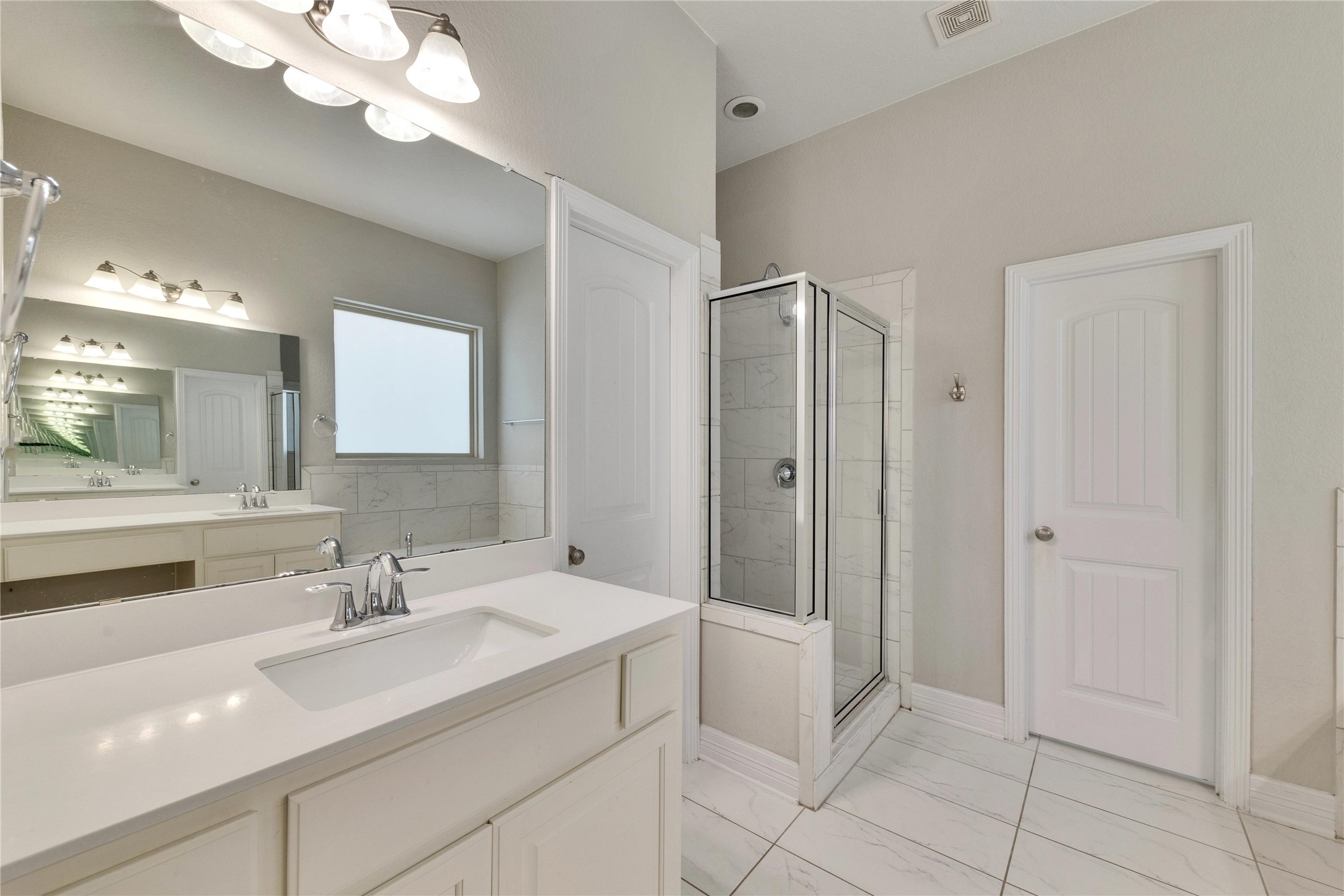 5213 Buchanan Draw Road Austin, TX 78738 - Photo 12 of 33 a bathroom with a sink vanity and a mirror