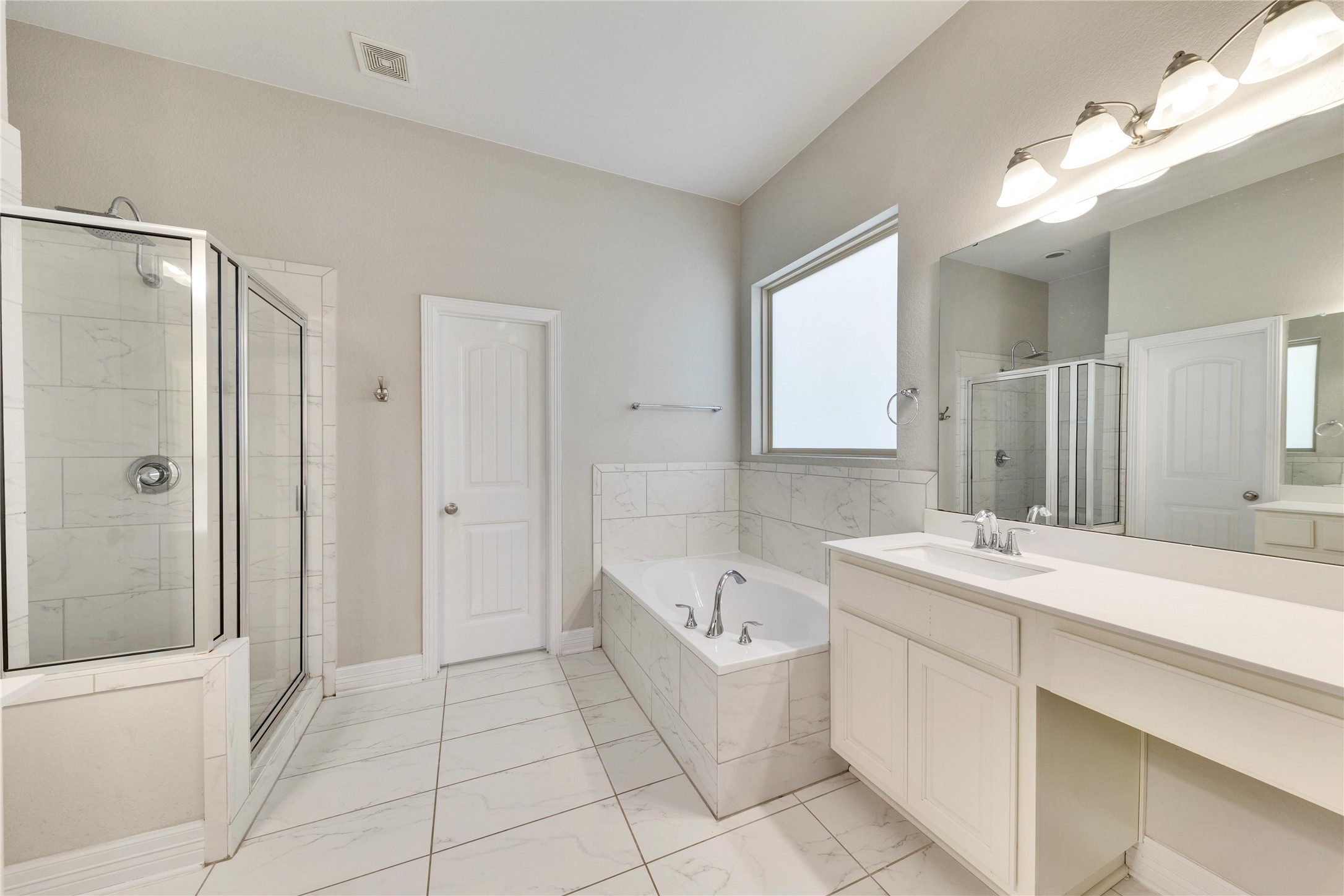5213 Buchanan Draw Road Austin, TX 78738 - Photo 13 of 33 a bathroom with a tub sink and mirror